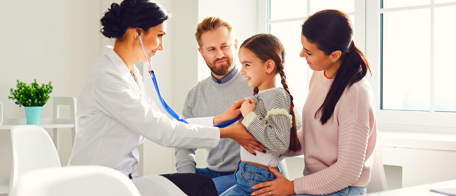 doctor checking her young patient