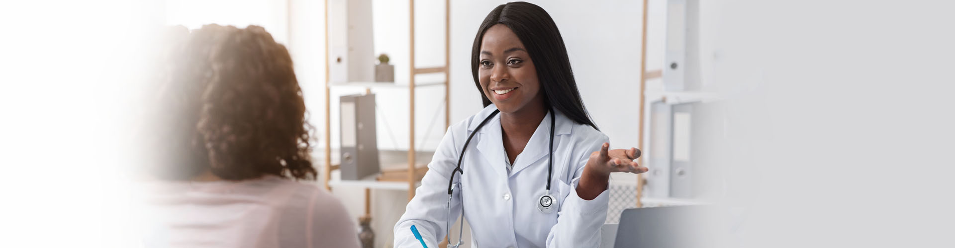 doctor listening to her patient