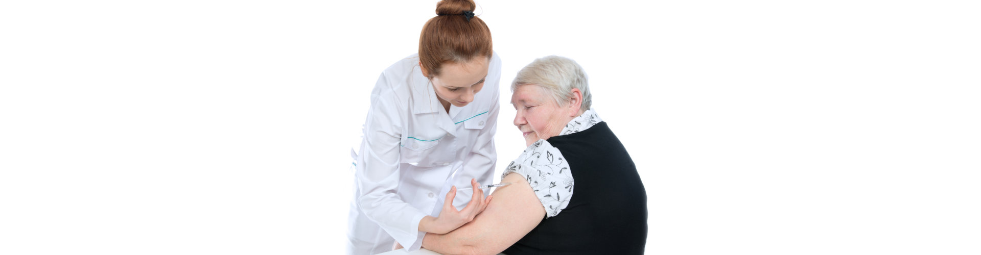 a doctor performing an injection to the elderly woman